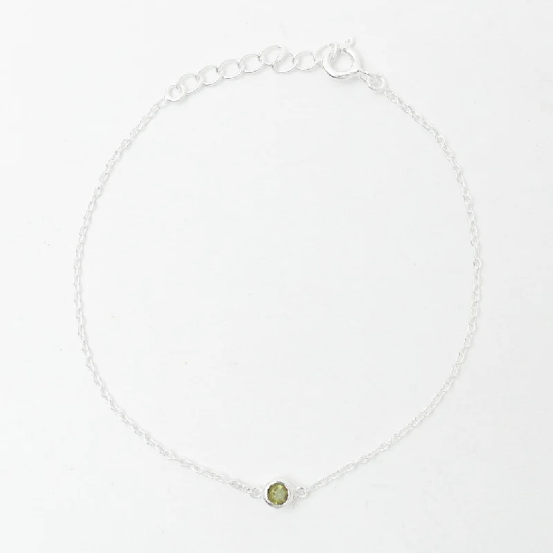 Simple bangle bracelets with smooth matte finishes for a subtle and modern style-Silver Peridot Solitaire Bracelet